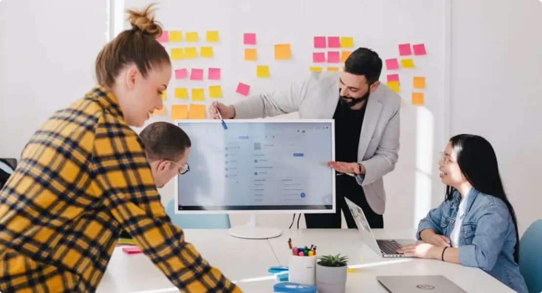 Team collaborating during a CRO presentation.
