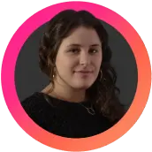 Person with dark curly hair in a circular pink and orange frame, representing LinkGraph's sales team.