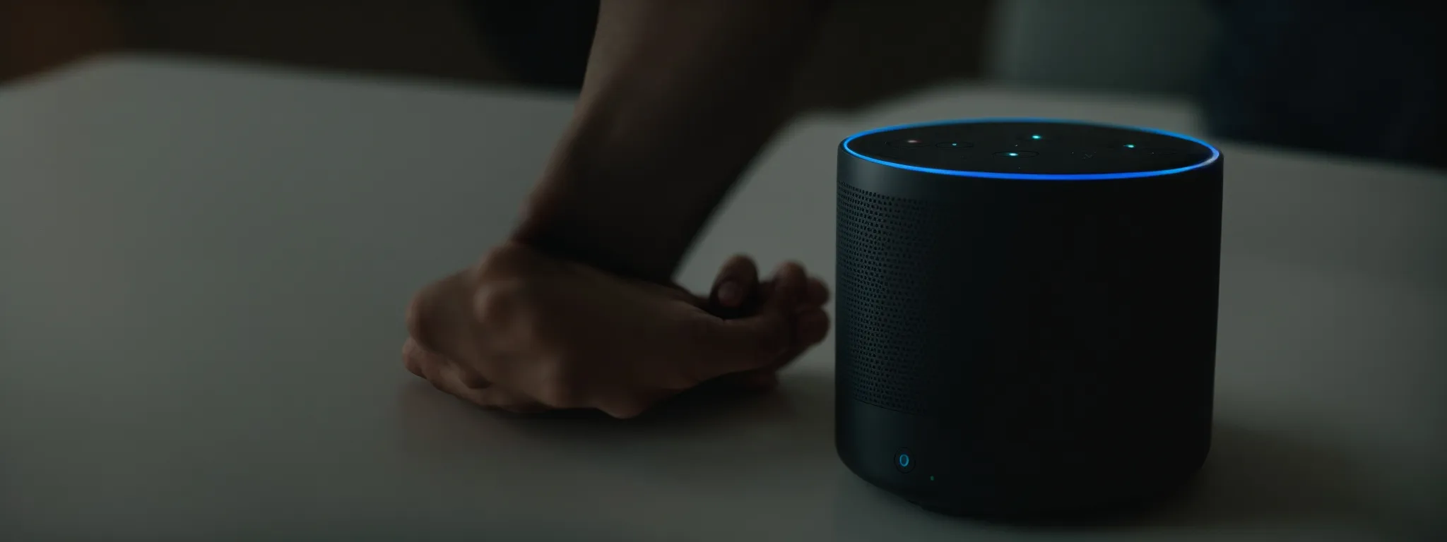 a person speaking into a smart speaker, initiating a voice search.