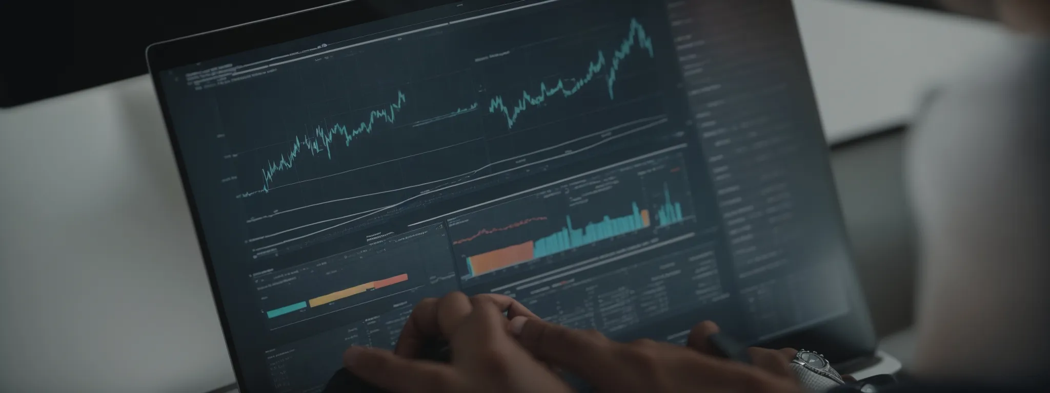 a person analyzing graphs and charts on a computer screen showing website analytics data.