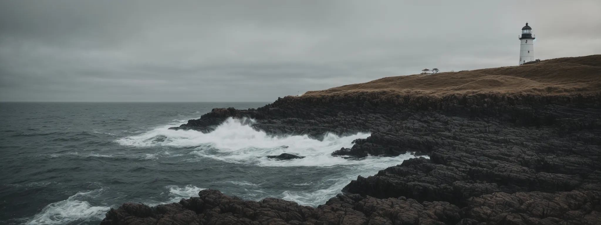 a lighthouse stands alone on a rocky shoreline, symbolizing guidance amid the unseen dangers in the surrounding waters.