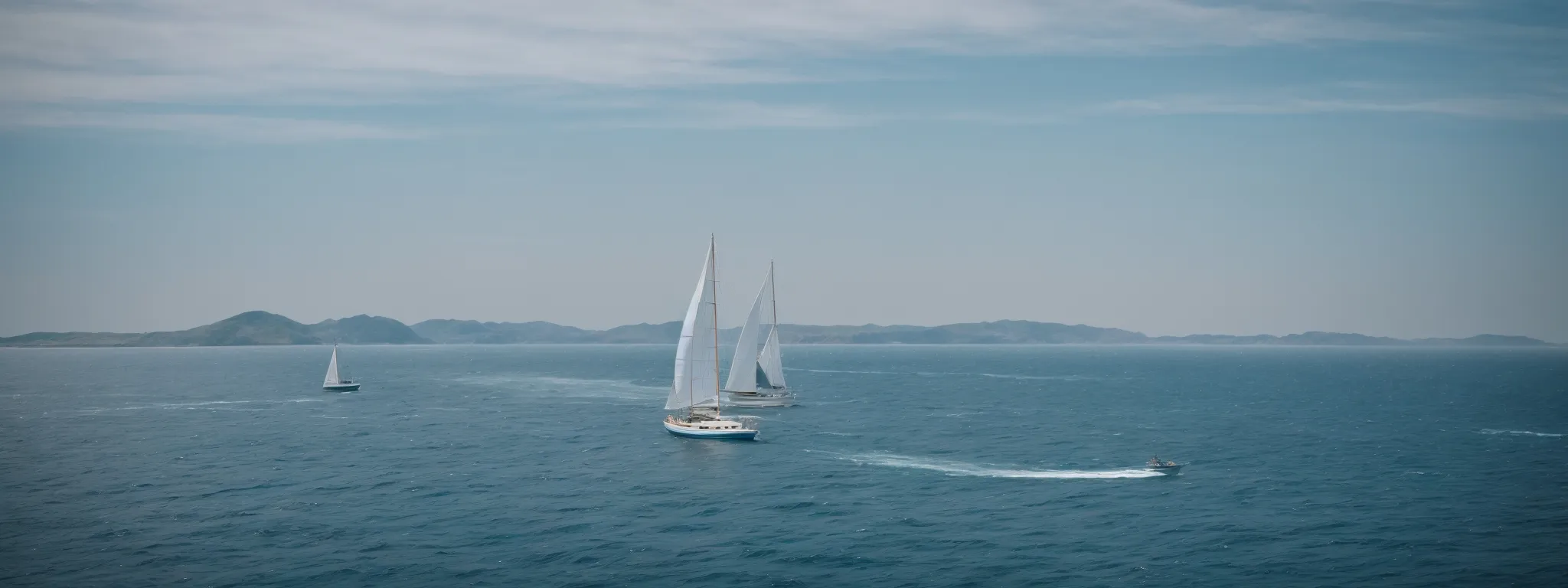 a small sailboat overtaking larger ships against the backdrop of a vast ocean.