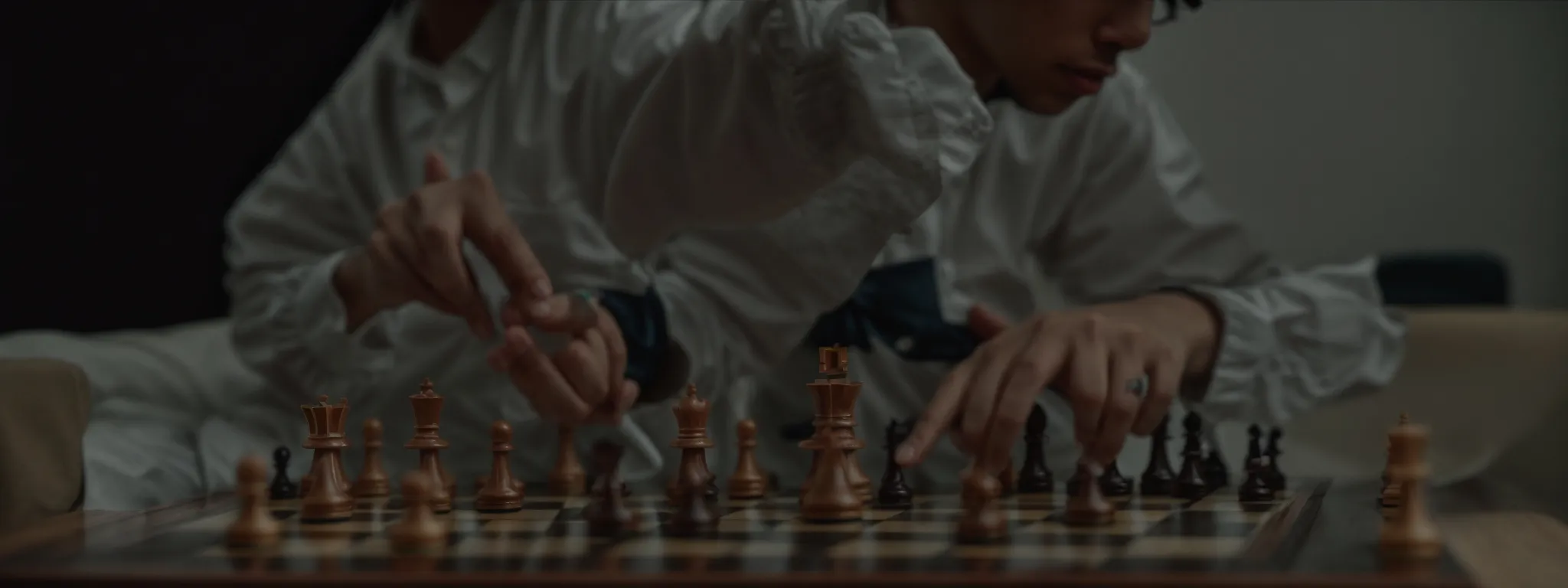 a chess player strategically moving a piece across a chessboard.