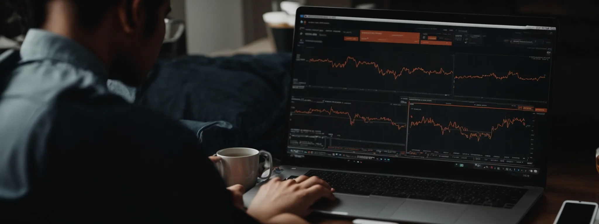 a marketer sits in front of a laptop, analyzing a chart showing website traffic growth.