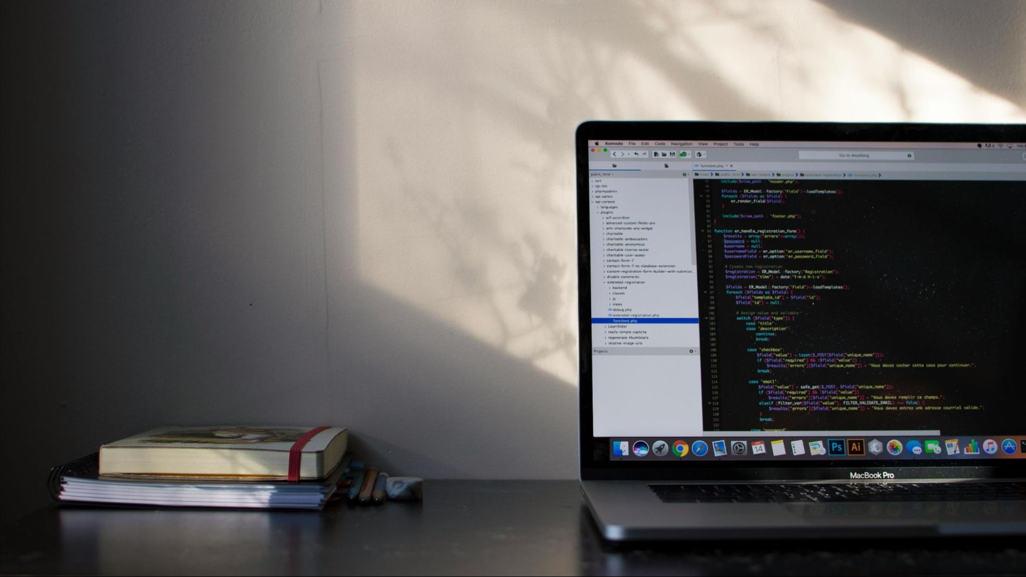 A laptop displaying code emphasizing the role of technical SEO in optimizing websites for better performance, faster load times, and improved search engine rankings